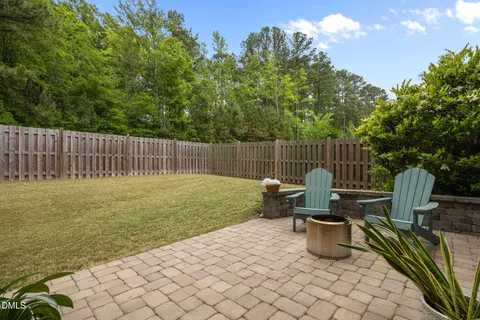 a view of a deck with a table and chairs