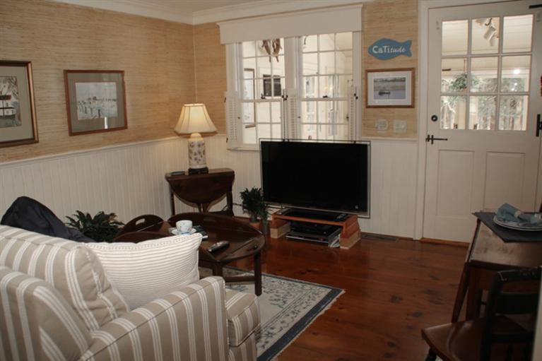 148 Point Hill Road West Barnstable, MA 02668 - Photo 13 of 35 a living room with furniture a flat screen tv and a window