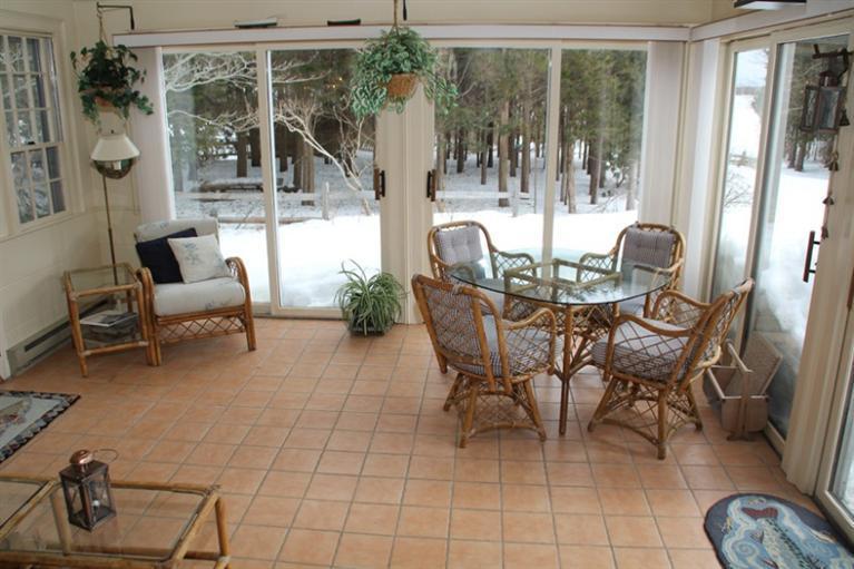 148 Point Hill Road West Barnstable, MA 02668 - Photo 14 of 35 a dining room with furniture and a floor to ceiling window