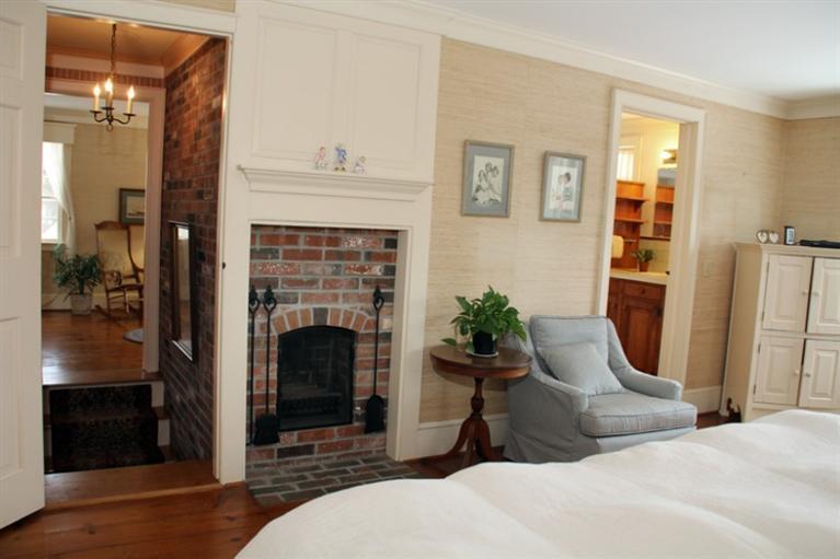 148 Point Hill Road West Barnstable, MA 02668 - Photo 18 of 35 a living room with furniture and a fireplace