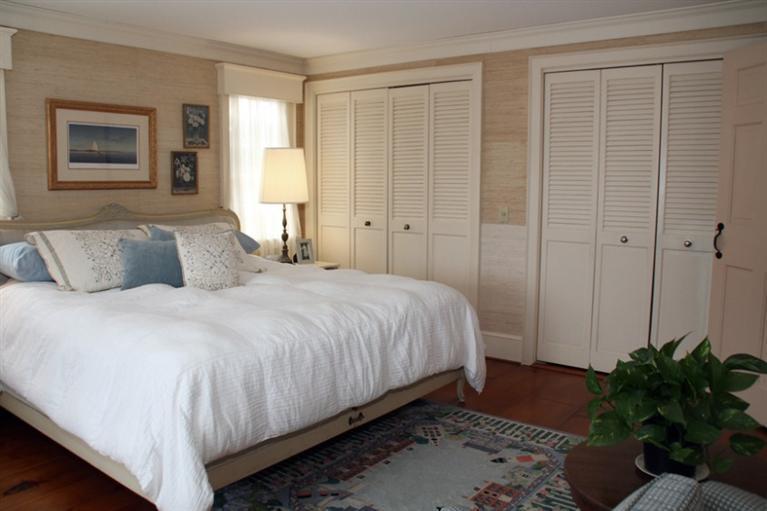148 Point Hill Road West Barnstable, MA 02668 - Photo 19 of 35 a bedroom with a bed and a potted plant