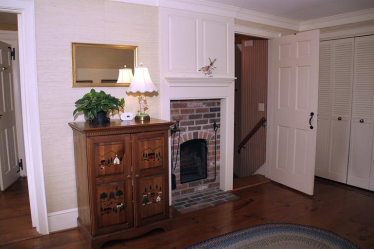 148 Point Hill Road West Barnstable, MA 02668 - Photo 25 of 35 a living room with furniture and a fireplace