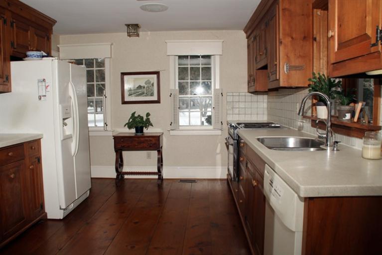 148 Point Hill Road West Barnstable, MA 02668 - Photo 3 of 35 a kitchen with stainless steel appliances granite countertop a refrigerator a sink a stove and wooden floors