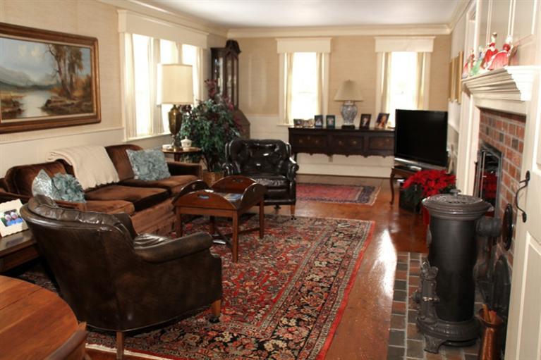 148 Point Hill Road West Barnstable, MA 02668 - Photo 4 of 35 a living room with furniture a fireplace and a flat screen tv