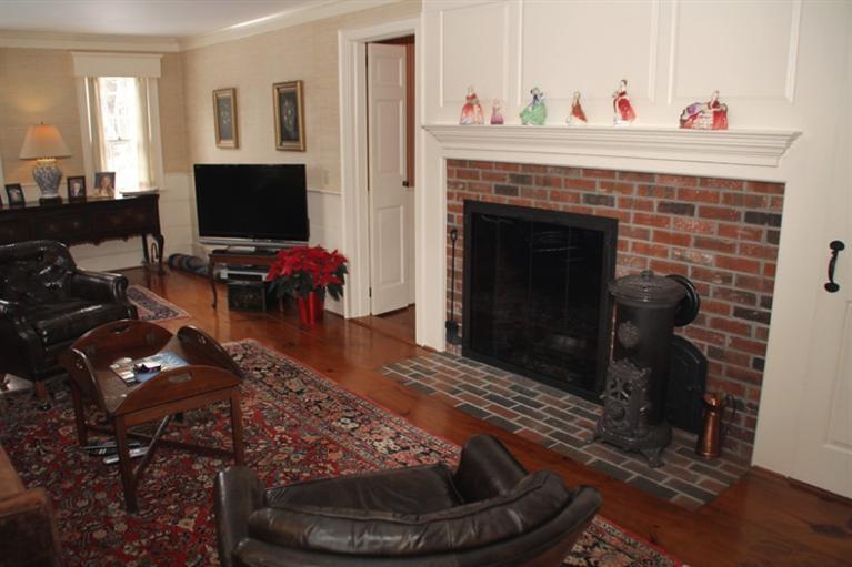 148 Point Hill Road West Barnstable, MA 02668 - Photo 5 of 35 a living room with furniture and a fireplace