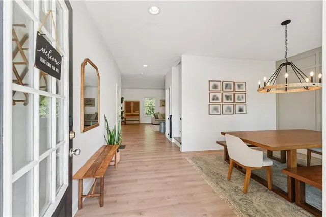 a view of a chairs and table in the balcony