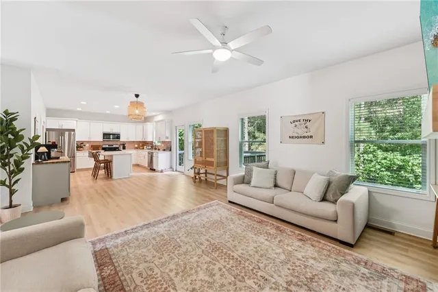 a living room with furniture and a large window