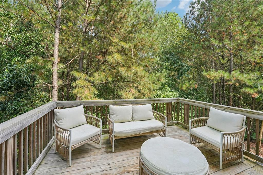 621 Stonehurst Lane Canton, GA 30114 - Photo 19 of 62 a balcony with wooden floor and furniture