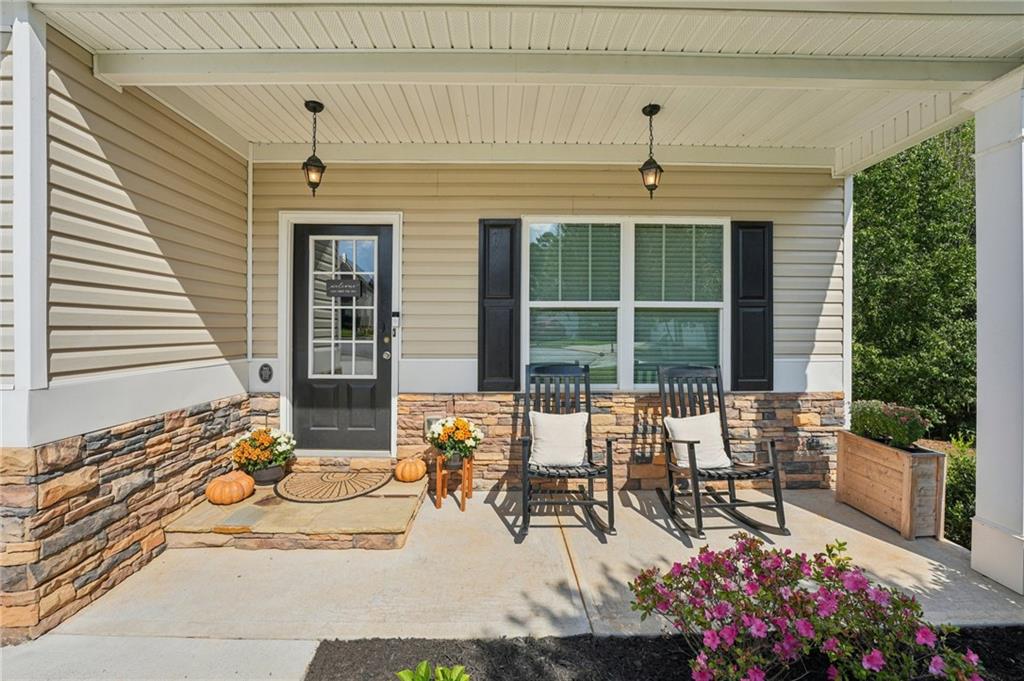 621 Stonehurst Lane Canton, GA 30114 - Photo 2 of 62 a view of a chairs and table in the balcony