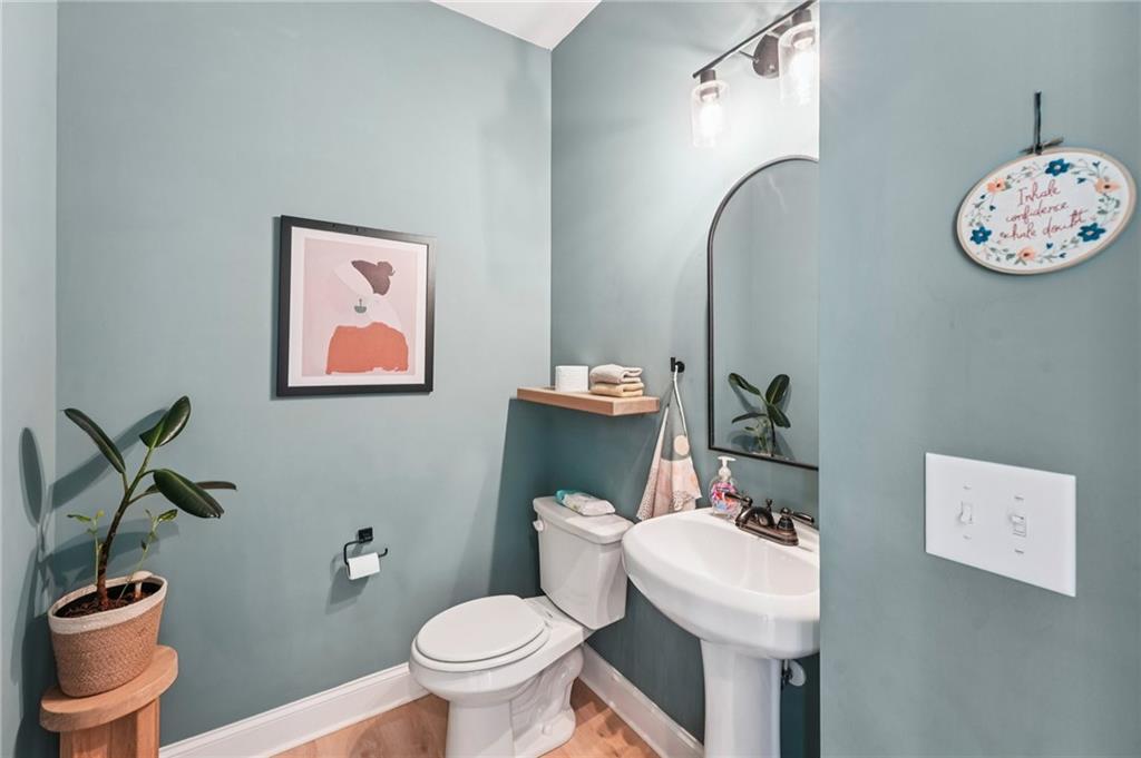 621 Stonehurst Lane Canton, GA 30114 - Photo 22 of 62 a bathroom with a toilet a sink and mirror