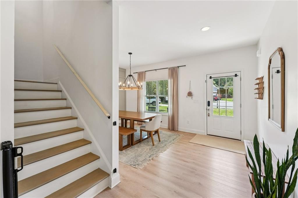 621 Stonehurst Lane Canton, GA 30114 - Photo 24 of 62 a view of a livingroom with wooden floor and stairs