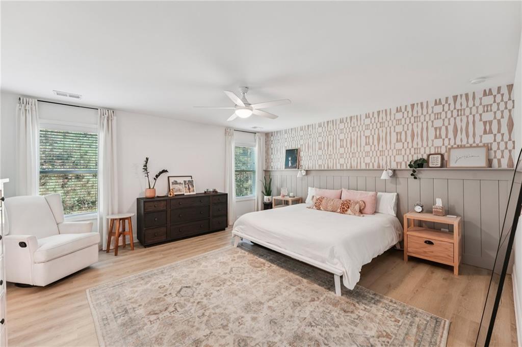 621 Stonehurst Lane Canton, GA 30114 - Photo 26 of 62 a bedroom with a bed and a couch