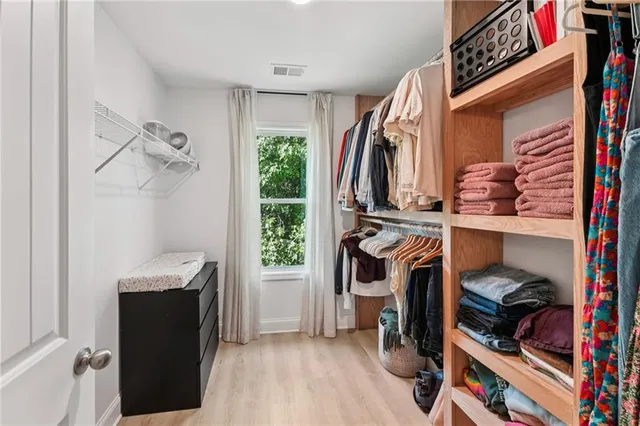 a bed room with a bed and a chandelier