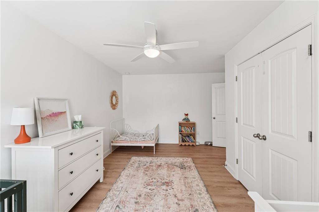 621 Stonehurst Lane Canton, GA 30114 - Photo 40 of 62 a bed room with a bed and a chandelier