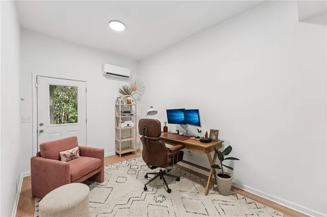 a bedroom with furniture and a wooden floor