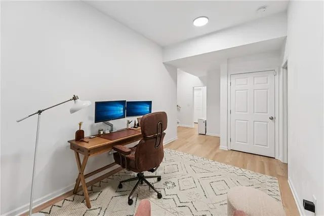 a view of a backyard with large trees and plants