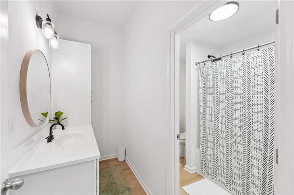 621 Stonehurst Lane Canton, GA 30114 - Photo 47 of 62 a bathroom with a sink vanity and a mirror
