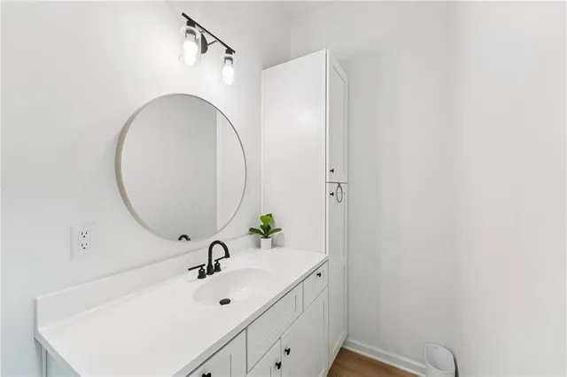 a front view of a house with yard and green space