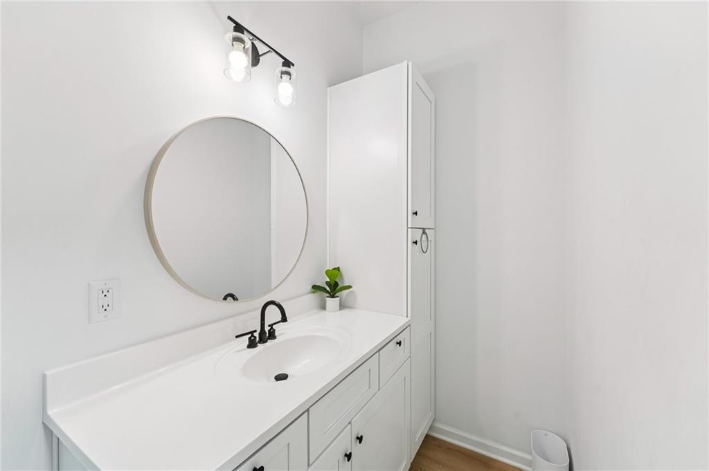 621 Stonehurst Lane Canton, GA 30114 - Photo 48 of 62 a bathroom with a sink and a mirror