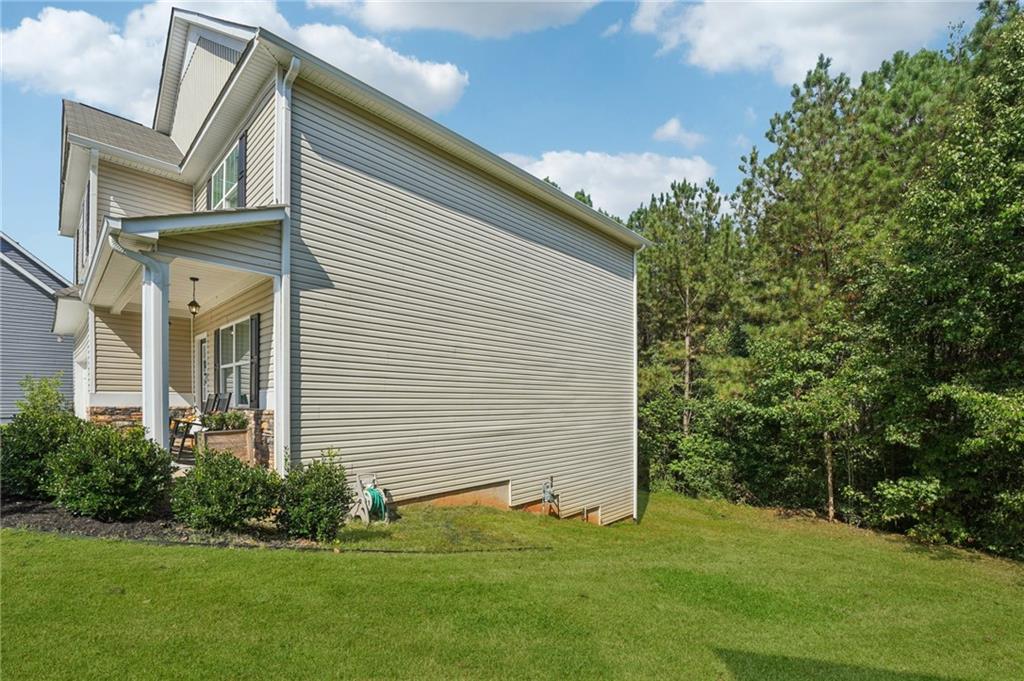 621 Stonehurst Lane Canton, GA 30114 - Photo 55 of 62 a front view of a house with a garden