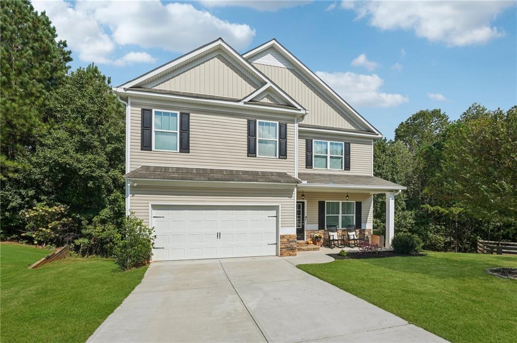 621 Stonehurst Lane Canton, GA 30114 - Photo 57 of 62 a front view of a house with yard and green space