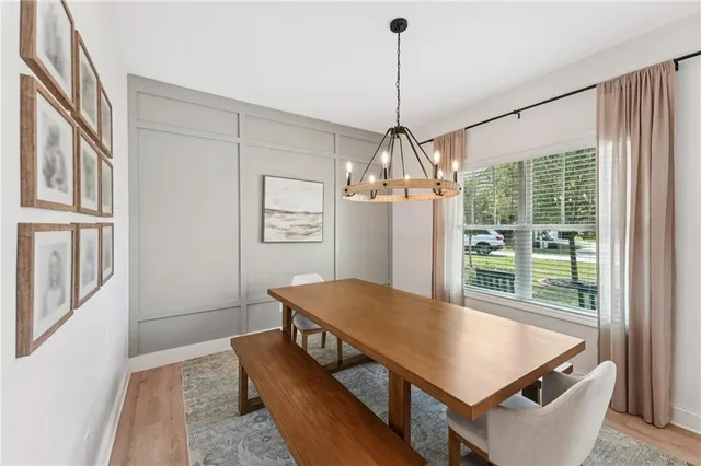 a living room with furniture a window and a chandelier