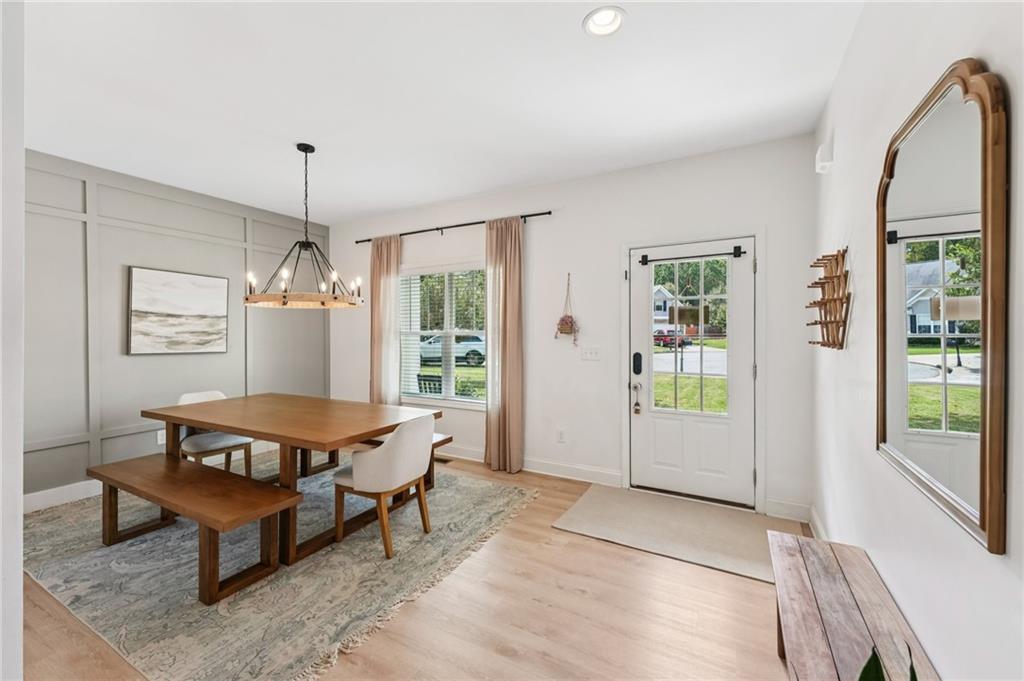 621 Stonehurst Lane Canton, GA 30114 - Photo 7 of 62 a living room with furniture a window and a chandelier