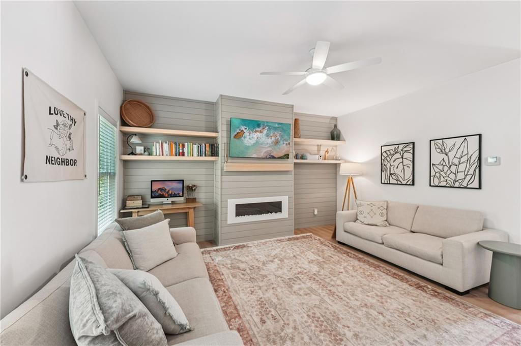 621 Stonehurst Lane Canton, GA 30114 - Photo 10 of 62 a living room with furniture and a flat screen tv