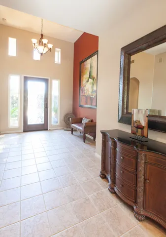a spacious bathroom with a mirror a bathtub and a sink