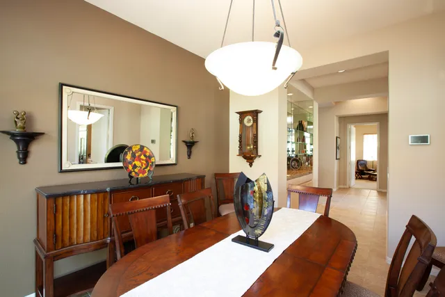 a view of a livingroom with furniture and a chandelier