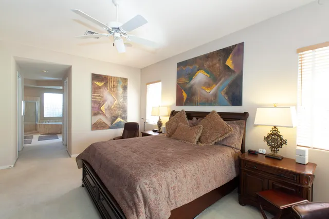 a bedroom with bed and window