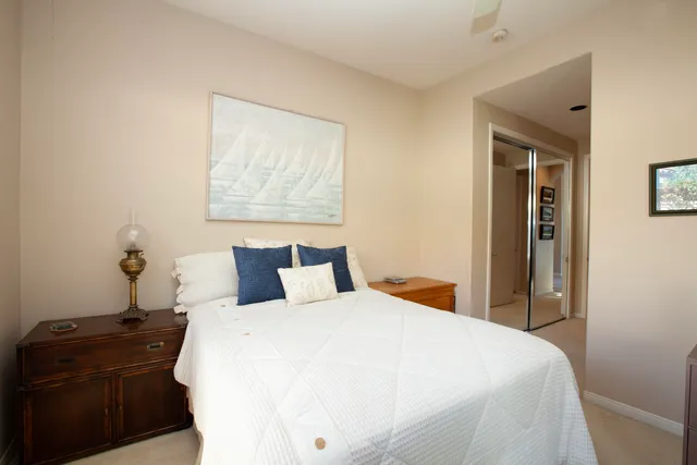 a bedroom with a bed and a dresser