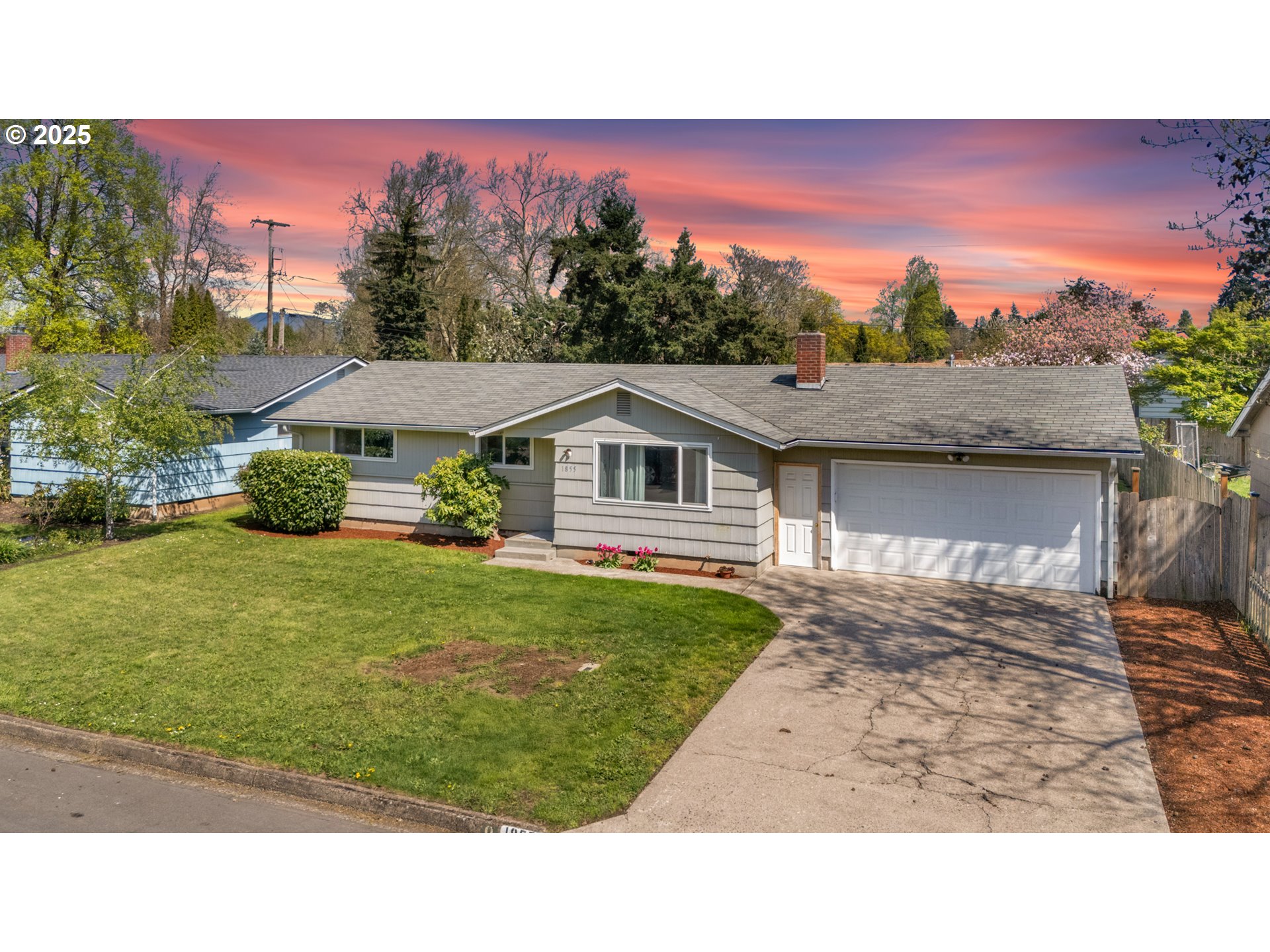 a balcony with furniture and a garden