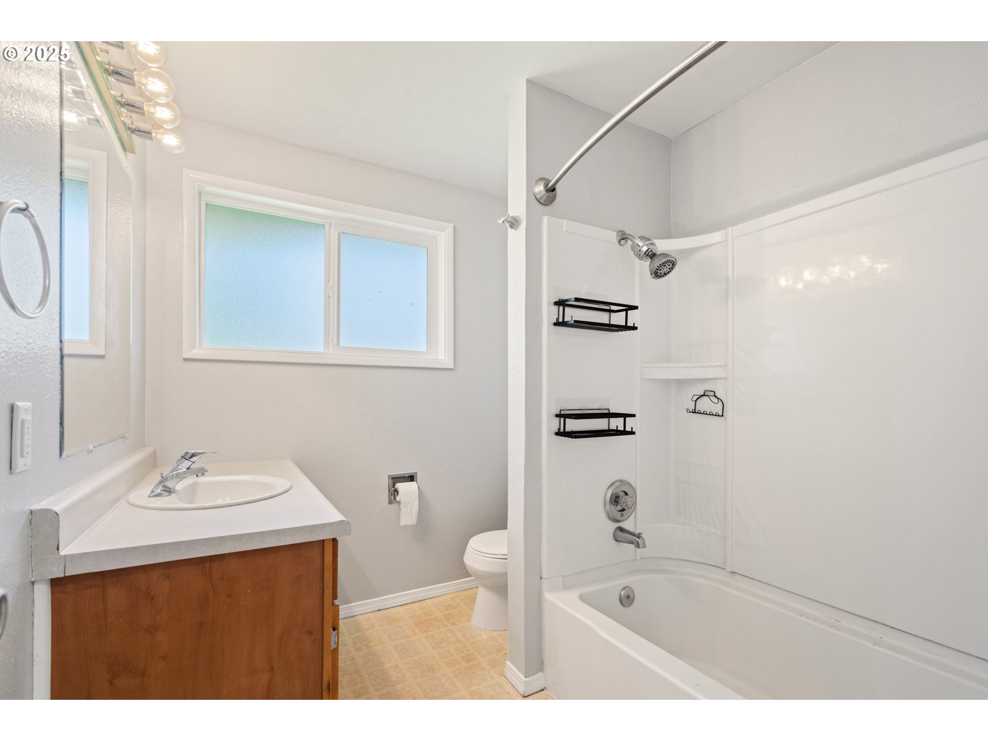 1855 Alderwood Street Eugene, OR 97404 - Photo 13 of 31 a bathroom with a sink a toilet and shower