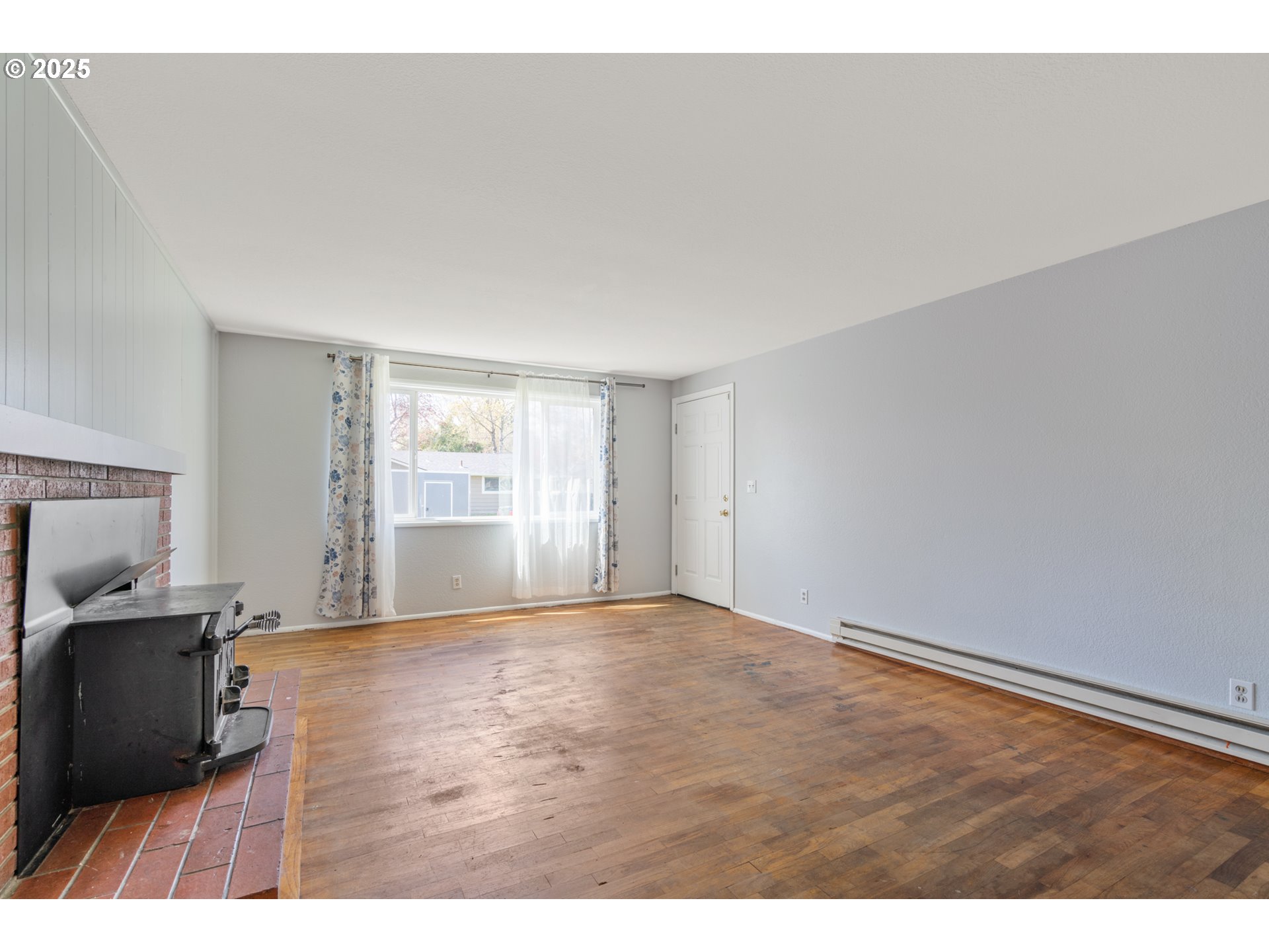 1855 Alderwood Street Eugene, OR 97404 - Photo 5 of 31 a view of an empty room with a window