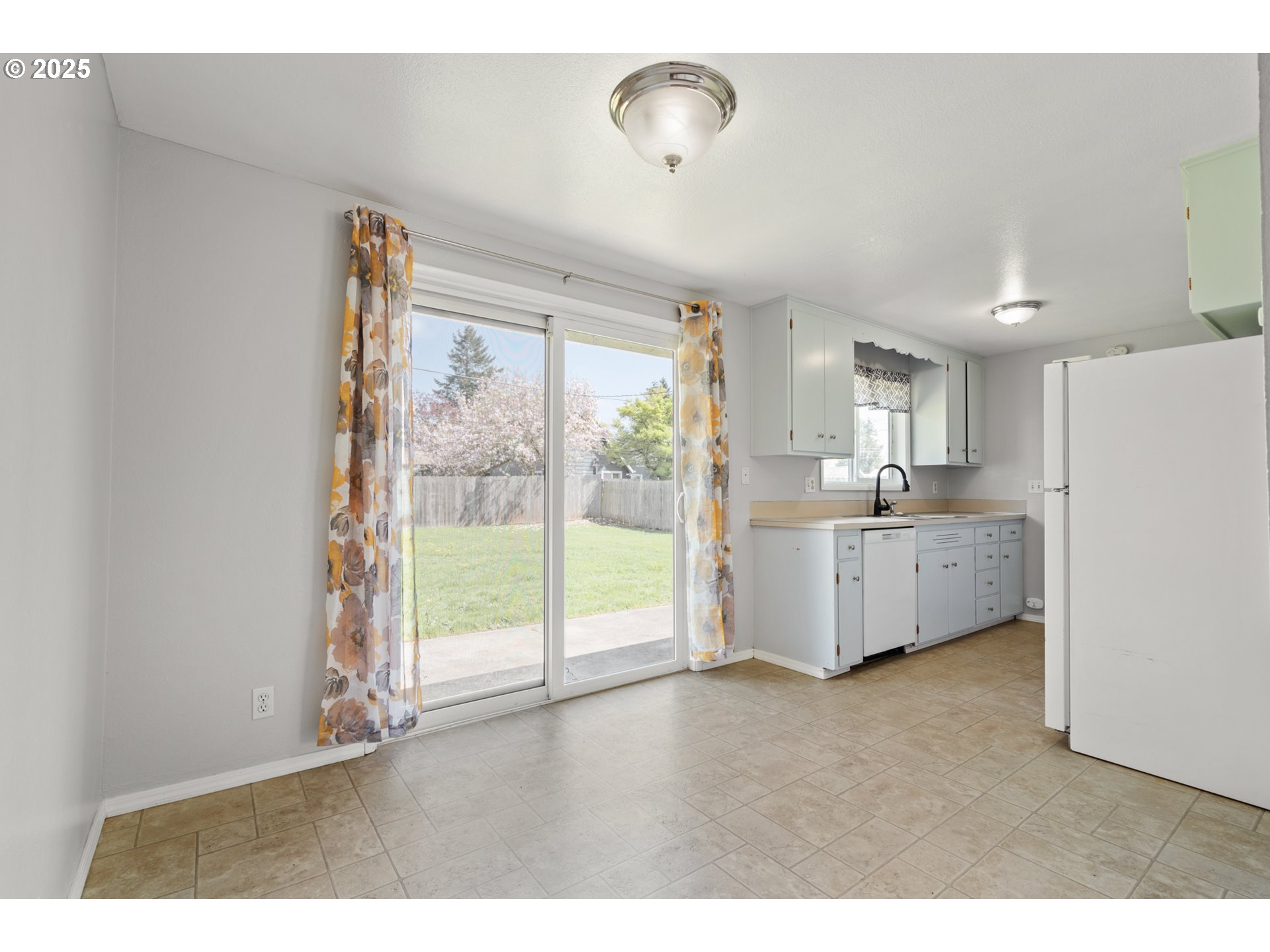 1855 Alderwood Street Eugene, OR 97404 - Photo 7 of 31 a view of a kitchen with wooden floor and windows