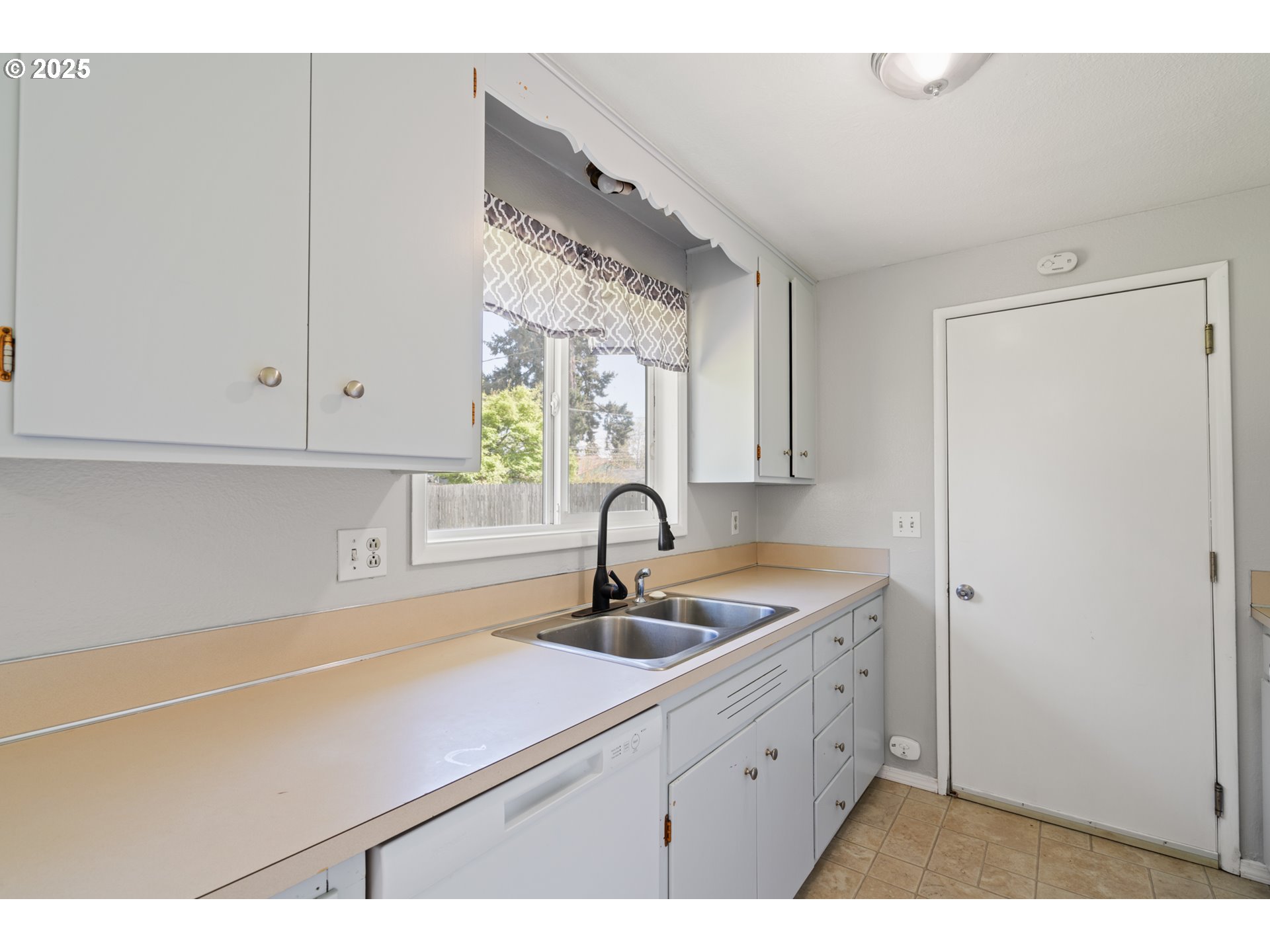 1855 Alderwood Street Eugene, OR 97404 - Photo 9 of 31 a kitchen with a sink and cabinets