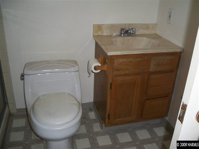 2540 Trident Way Reno, NV 89512 - Photo 8 of 9 a bathroom with a sink and toilet