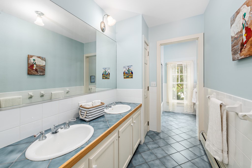 147 Beavertail Road Jamestown, RI 02835 - Photo 39 of 46 Full bath can be accessed from bedroom above garage with staircase going down to kitchen as well.