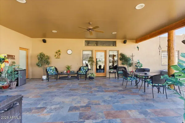 a kitchen with stainless steel appliances granite countertop a stove top oven a sink and a refrigerator