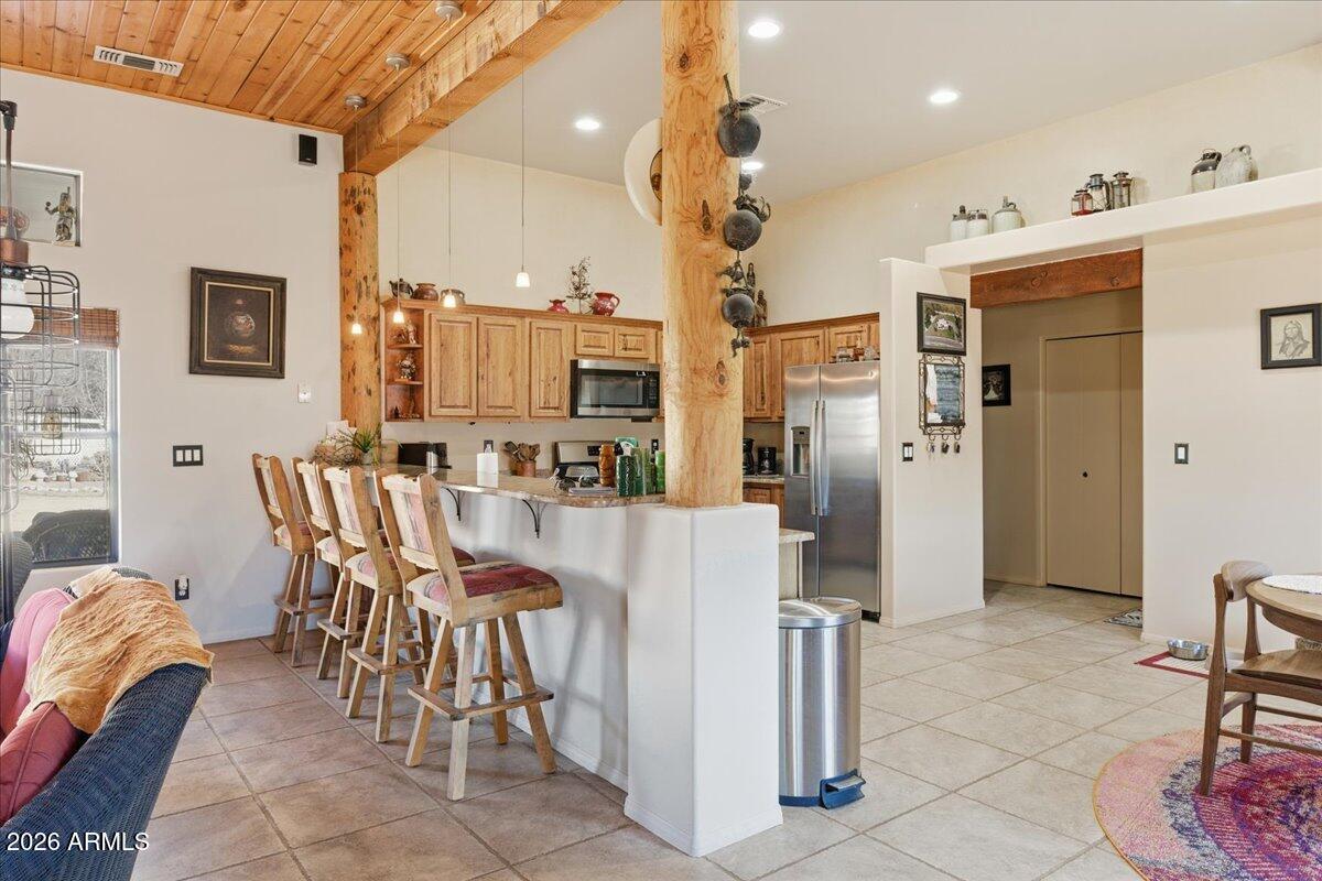 4605 Caughran Road Camp Verde, AZ 86322 - Photo 20 of 34 a dining room filled with furniture and a chandelier