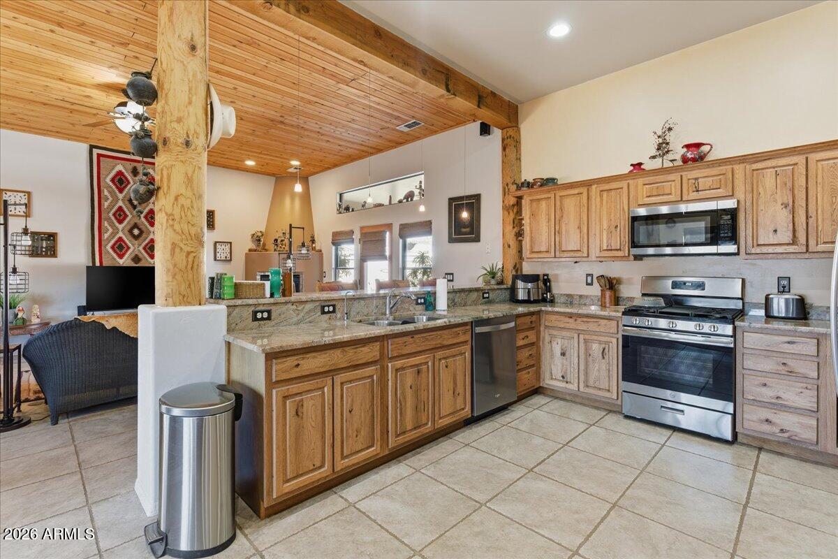 4605 Caughran Road Camp Verde, AZ 86322 - Photo 21 of 34 a kitchen with stainless steel appliances granite countertop a sink and cabinets