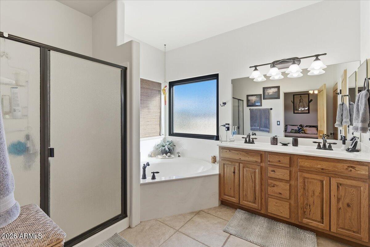 4605 Caughran Road Camp Verde, AZ 86322 - Photo 27 of 34 a bathroom with a double vanity sink mirror and double
