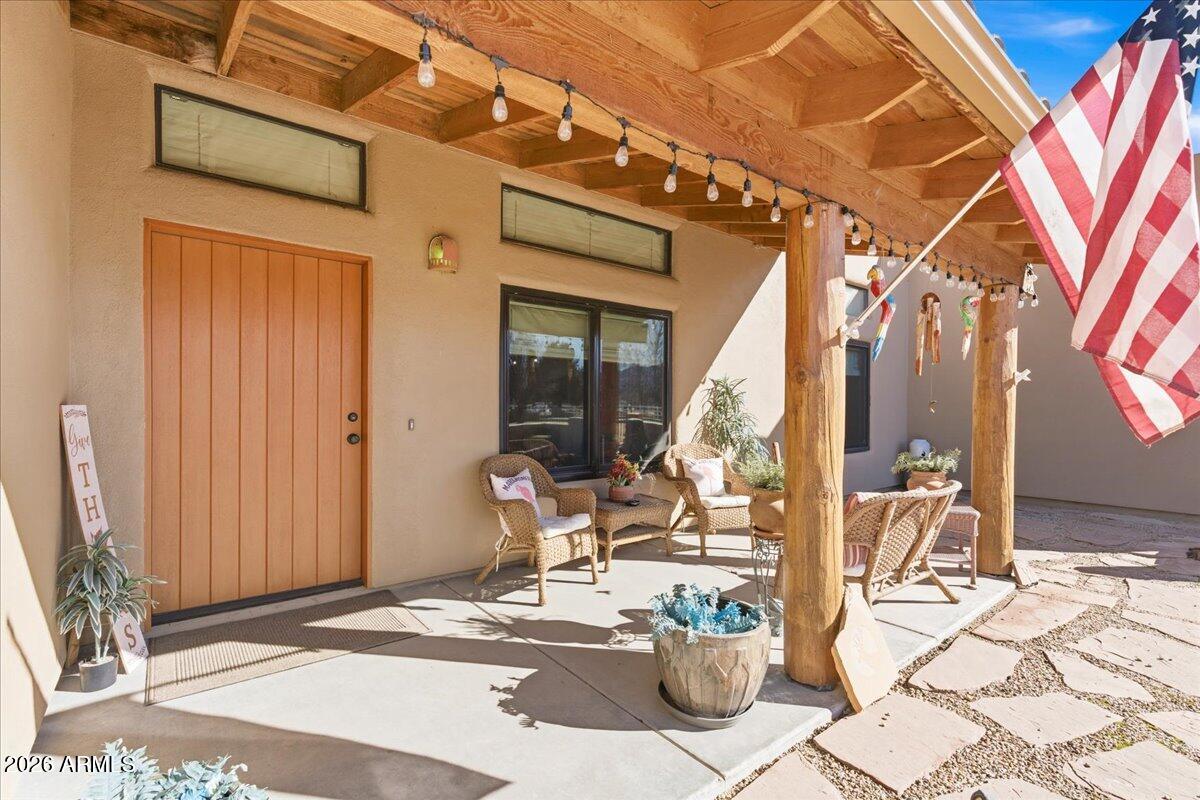 4605 Caughran Road Camp Verde, AZ 86322 - Photo 7 of 34 a building outdoor space with patio furniture and potted plants