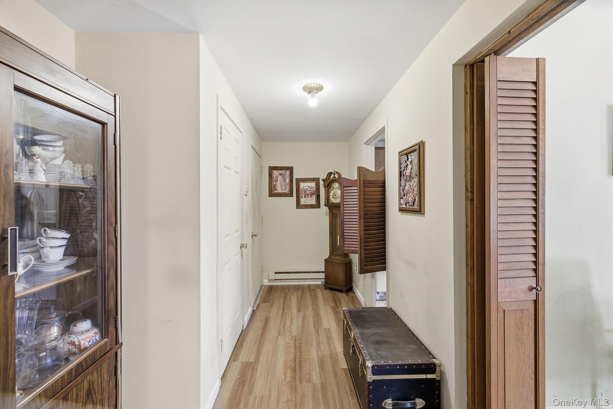 602 Holly Stream Court Brewster, NY 10509 - Photo 13 of 19 a view of a hallway with wooden floor and staircase