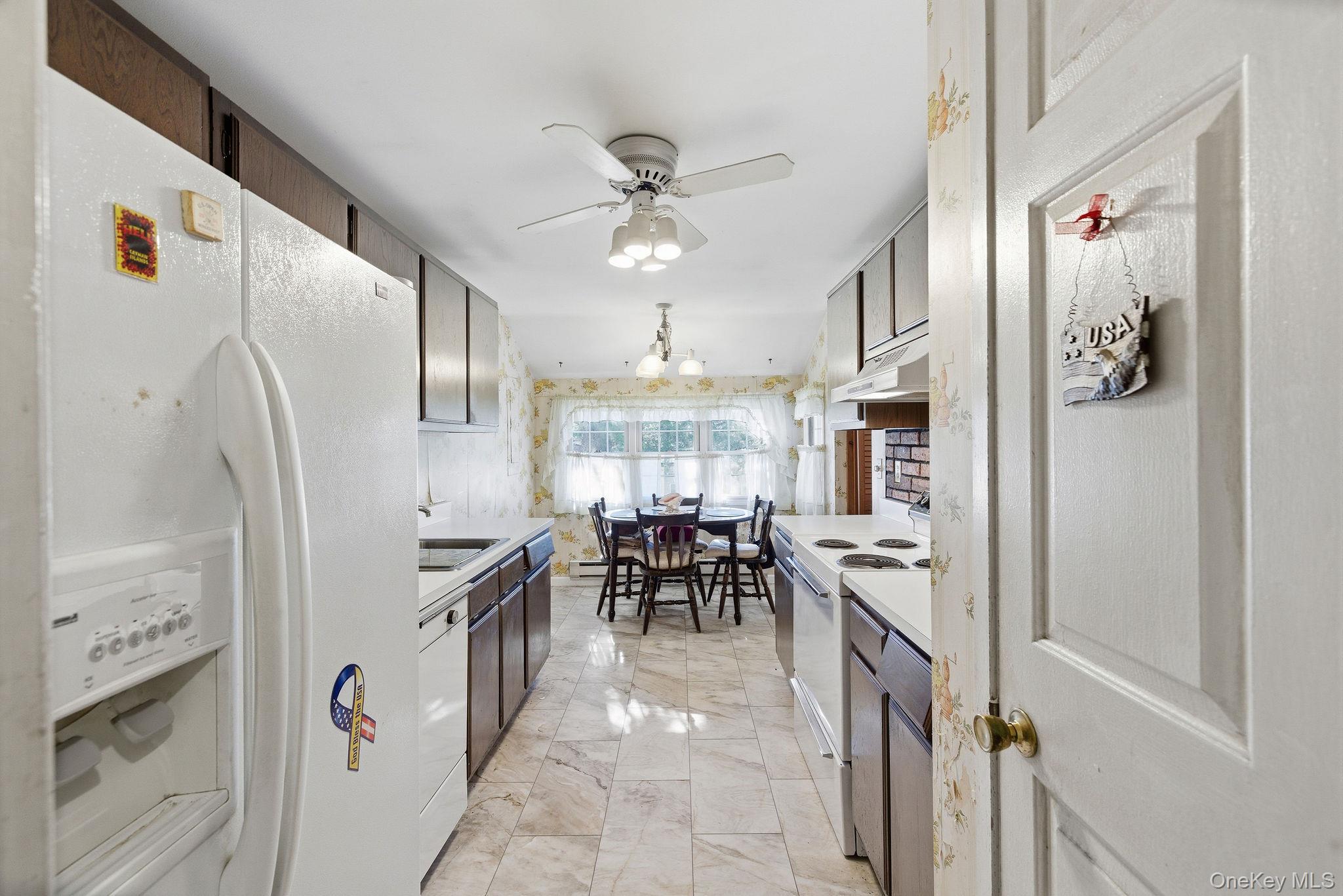 602 Holly Stream Court Brewster, NY 10509 - Photo 6 of 19 a kitchen with stainless steel appliances granite countertop a refrigerator and a stove top oven