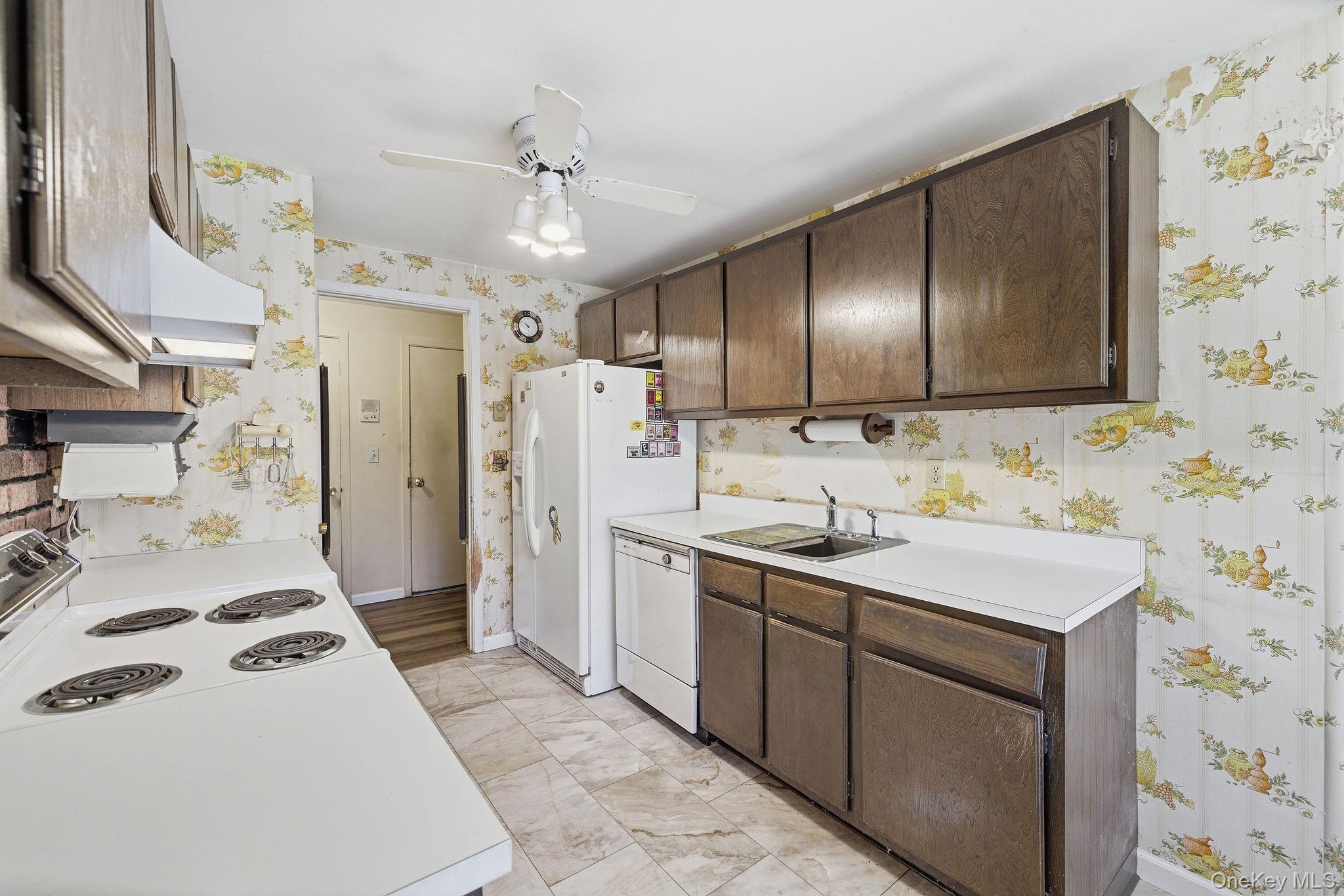 602 Holly Stream Court Brewster, NY 10509 - Photo 7 of 19 a kitchen with a sink stove and refrigerator