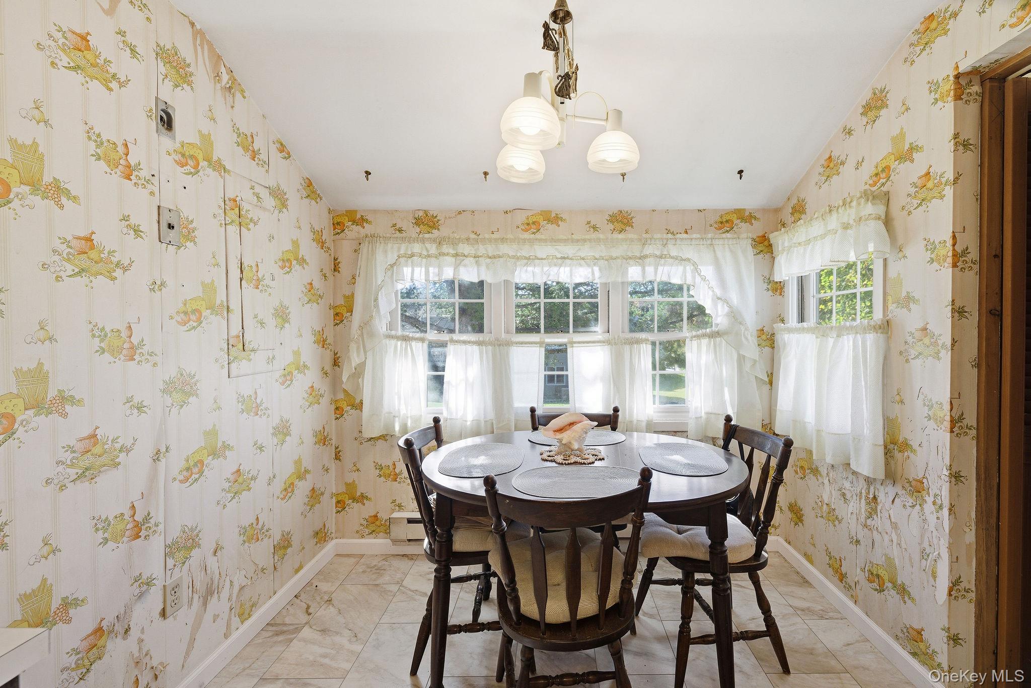 602 Holly Stream Court Brewster, NY 10509 - Photo 8 of 19 a view of a dining room with furniture and chandelier