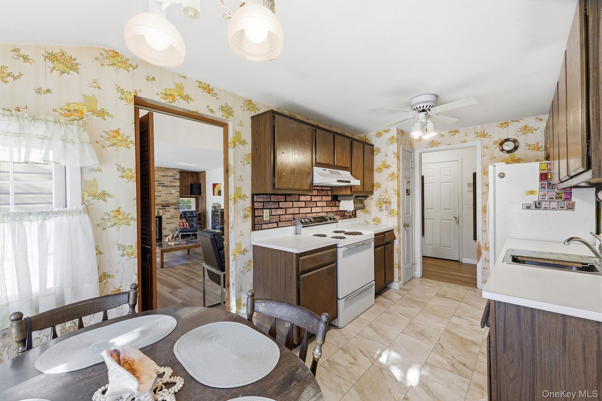 602 Holly Stream Court Brewster, NY 10509 - Photo 9 of 19 a kitchen with a sink appliances and cabinets