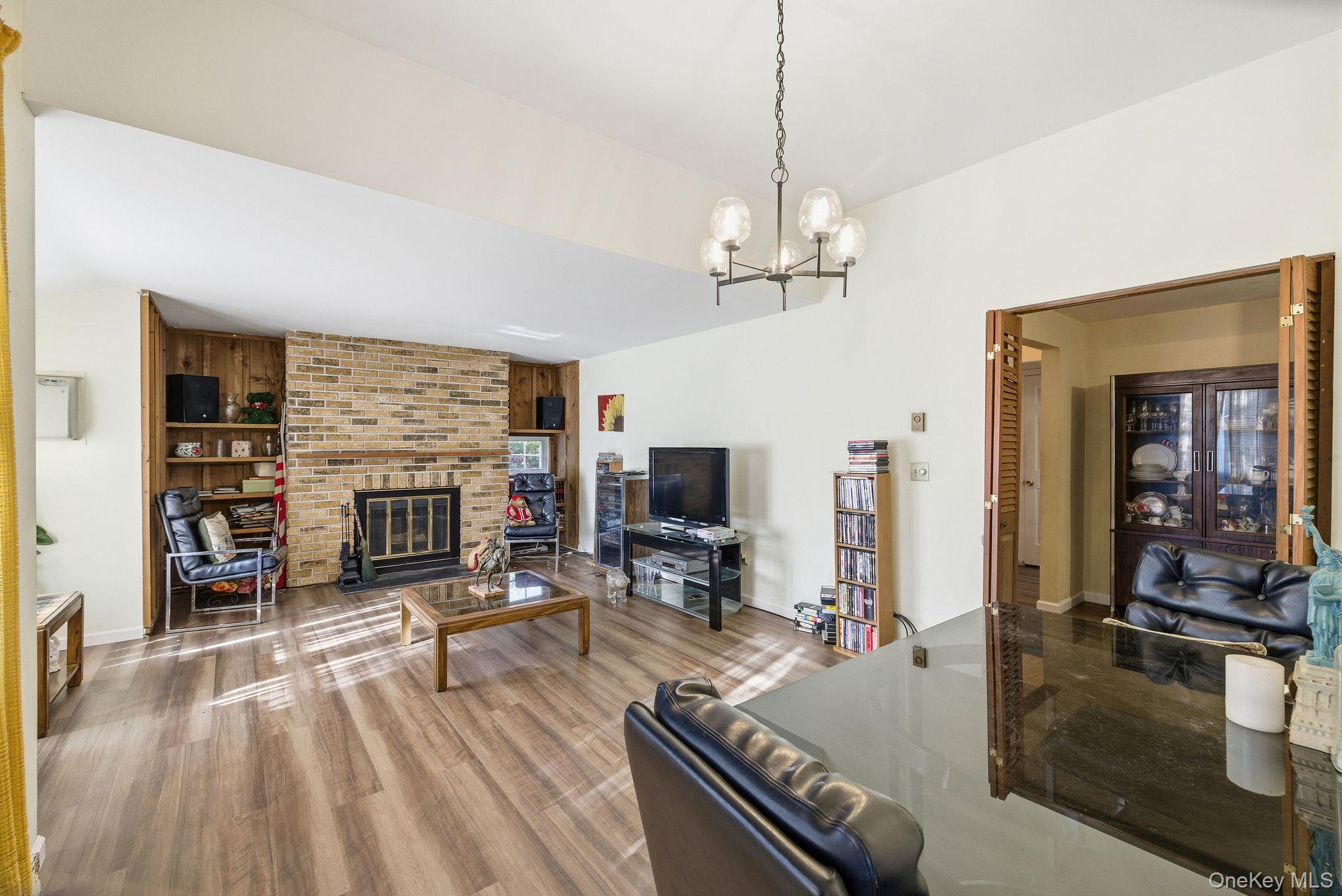 602 Holly Stream Court Brewster, NY 10509 - Photo 10 of 19 a living room with furniture and a flat screen tv